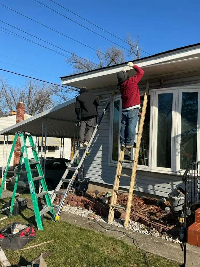 Restoration crew performing exterior repair in West Carson
